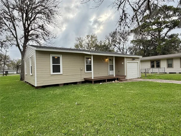 a house view with a garden space