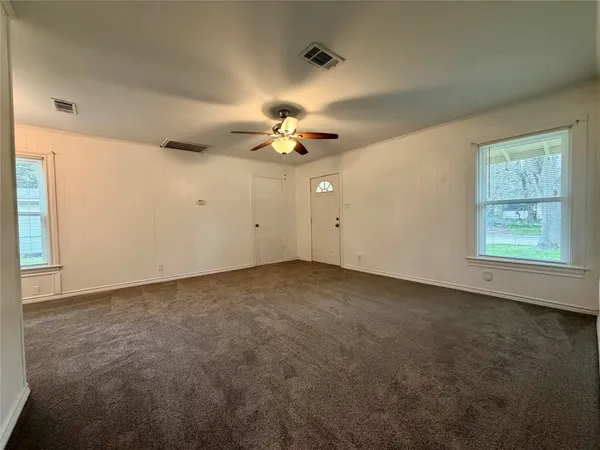 a view of an empty room with a window