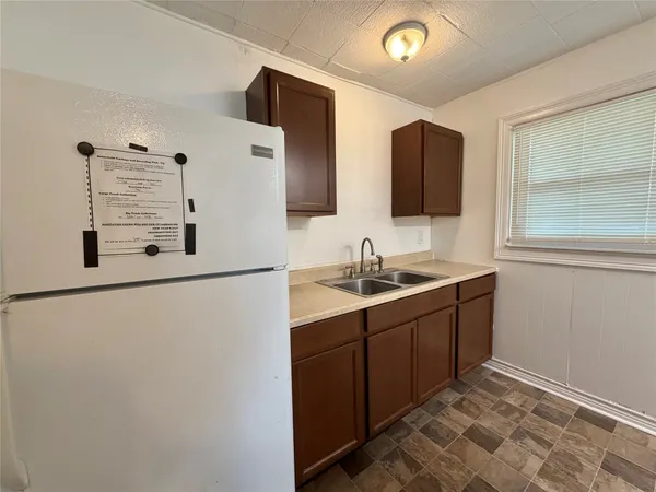 a bathroom with a double vanity sink and mirror