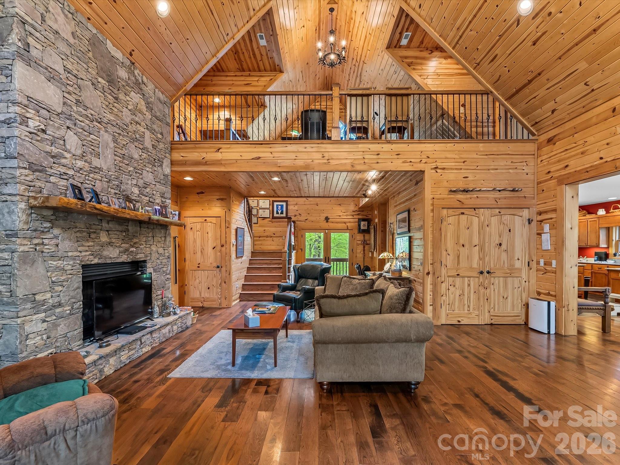 917 Otter Mountain Road Topton, NC 28781 - Photo 8 of 48 a living room with furniture and a fireplace