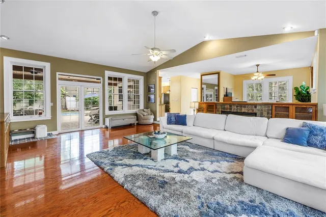 a spacious bedroom with a bed and a chandelier