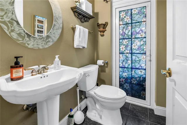 a bathroom with a sink a mirror and a shower