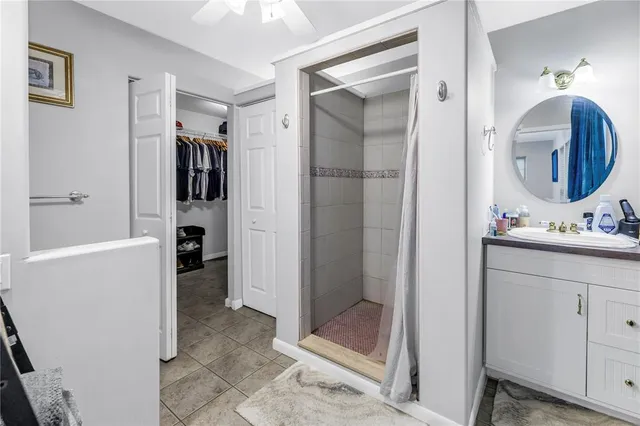a view of a balcony with wooden floor and fence