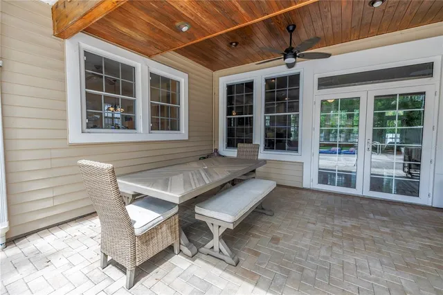 a view of a house with a patio and backyard