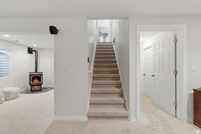 1888 East Cobblestone Road Springville, UT 84663 - Photo 33 of 44 Carpeted staircase with white risers and handrail