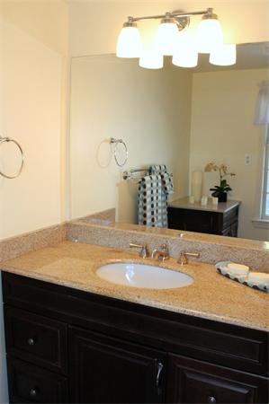 1 Bushnell Drive Lexington, MA 02421 - Photo 14 of 20 a bathroom with a sink and a mirror