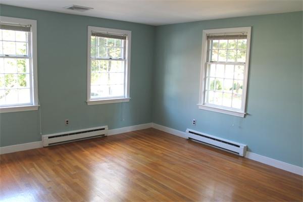 1 Bushnell Drive Lexington, MA 02421 - Photo 15 of 20 a view of an empty room with wooden floor and a window