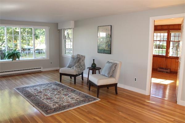 1 Bushnell Drive Lexington, MA 02421 - Photo 3 of 20 a living room with a rug and a table