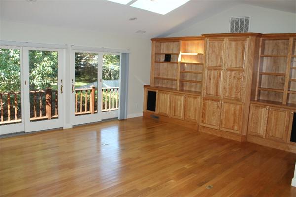 1 Bushnell Drive Lexington, MA 02421 - Photo 6 of 20 an empty room with wooden floor and windows