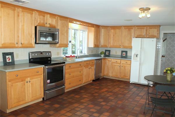 1 Bushnell Drive Lexington, MA 02421 - Photo 9 of 20 a kitchen with a sink stove and refrigerator