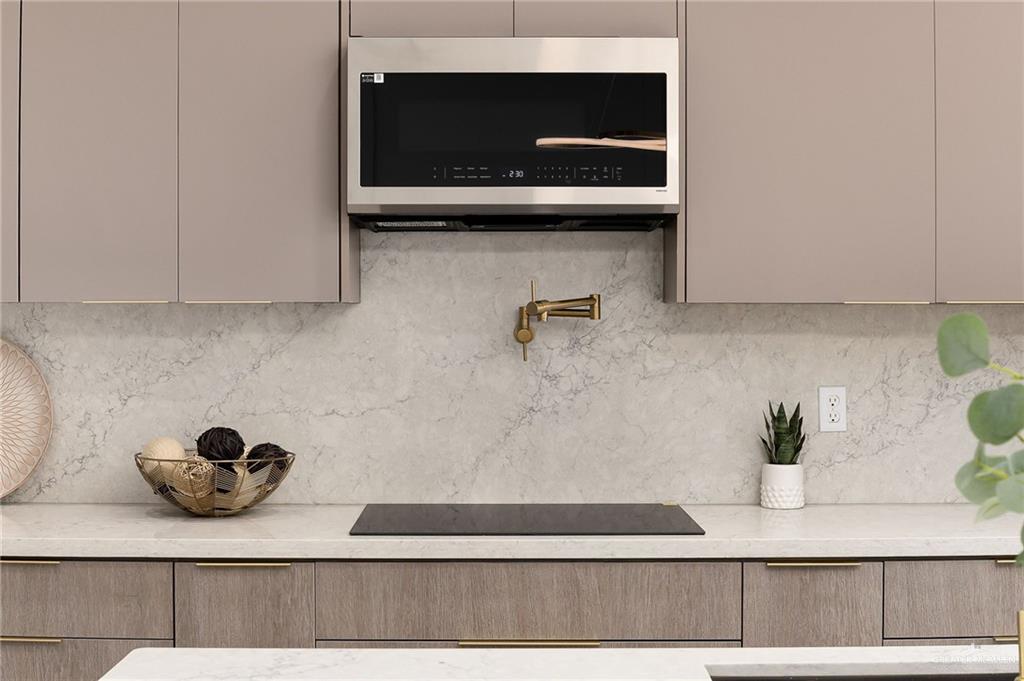 9119 North 25th Street McAllen, TX 78504 - Photo 11 of 22 a kitchen with a sink and cabinets
