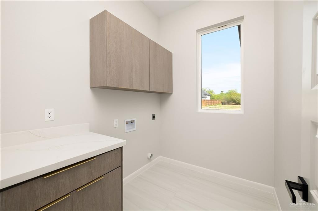 9119 North 25th Street McAllen, TX 78504 - Photo 13 of 22 a room with a sink and a cabinet