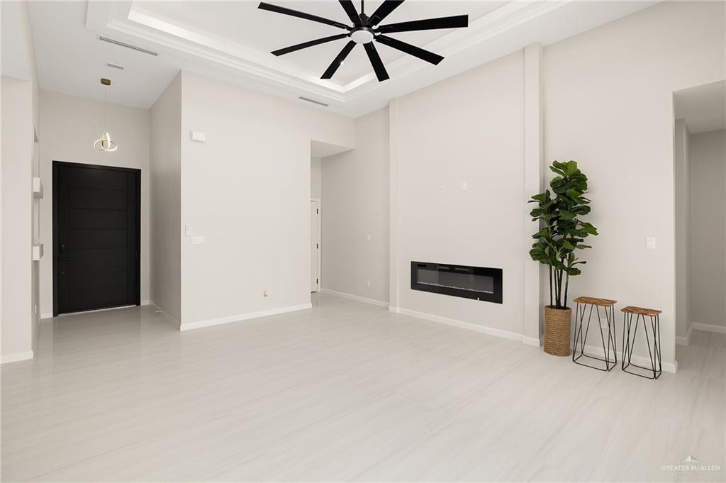 9119 North 25th Street McAllen, TX 78504 - Photo 5 of 22 a view of an empty room with a potted plant