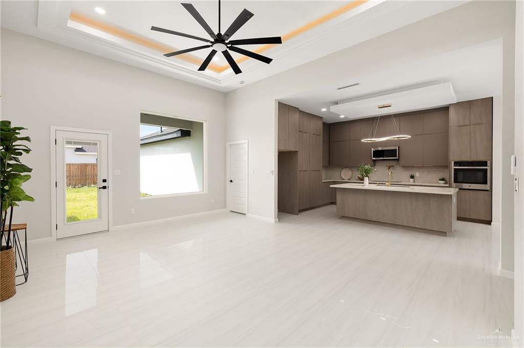 9119 North 25th Street McAllen, TX 78504 - Photo 6 of 22 a view of a livingroom with a kitchen