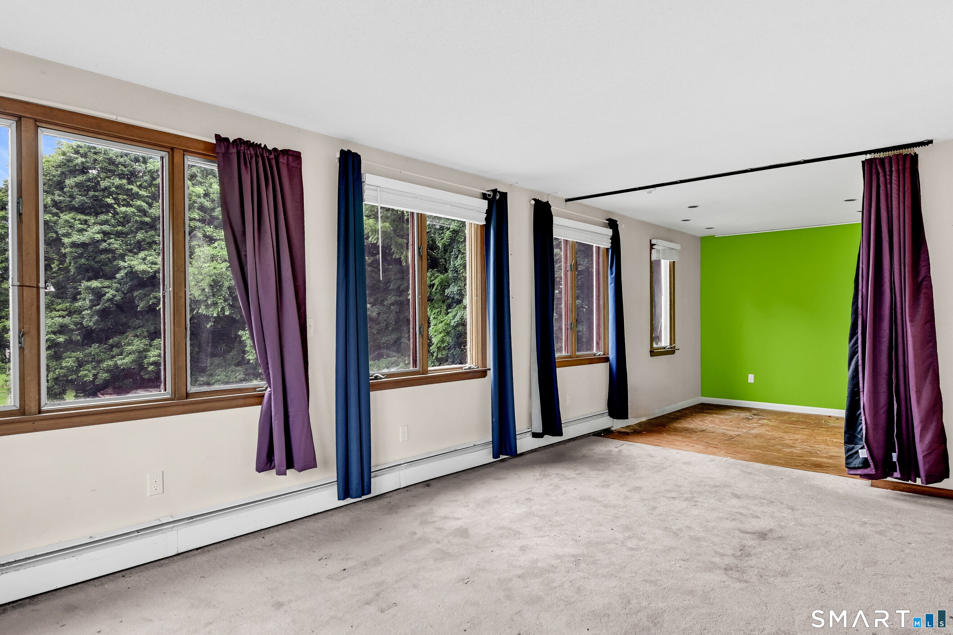 295 Wolcott Hill Road Wethersfield, CT 06109 - Photo 27 of 40 Apartment Living room looking into could-be kitchen (green wall could be kitchen)