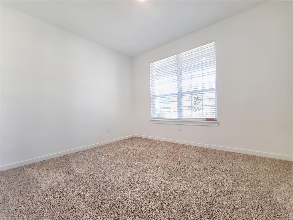 2032 Bobtail Pass Leander, TX 78641 - Photo 11 of 18 an empty room with windows