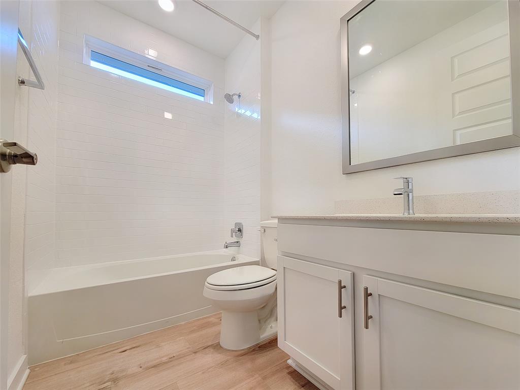 2032 Bobtail Pass Leander, TX 78641 - Photo 12 of 18 a bathroom with a sink toilet and shower