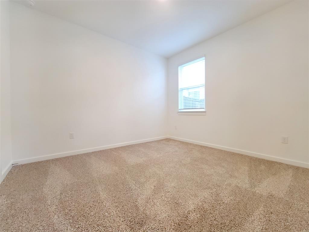 2032 Bobtail Pass Leander, TX 78641 - Photo 13 of 18 an empty room with a window