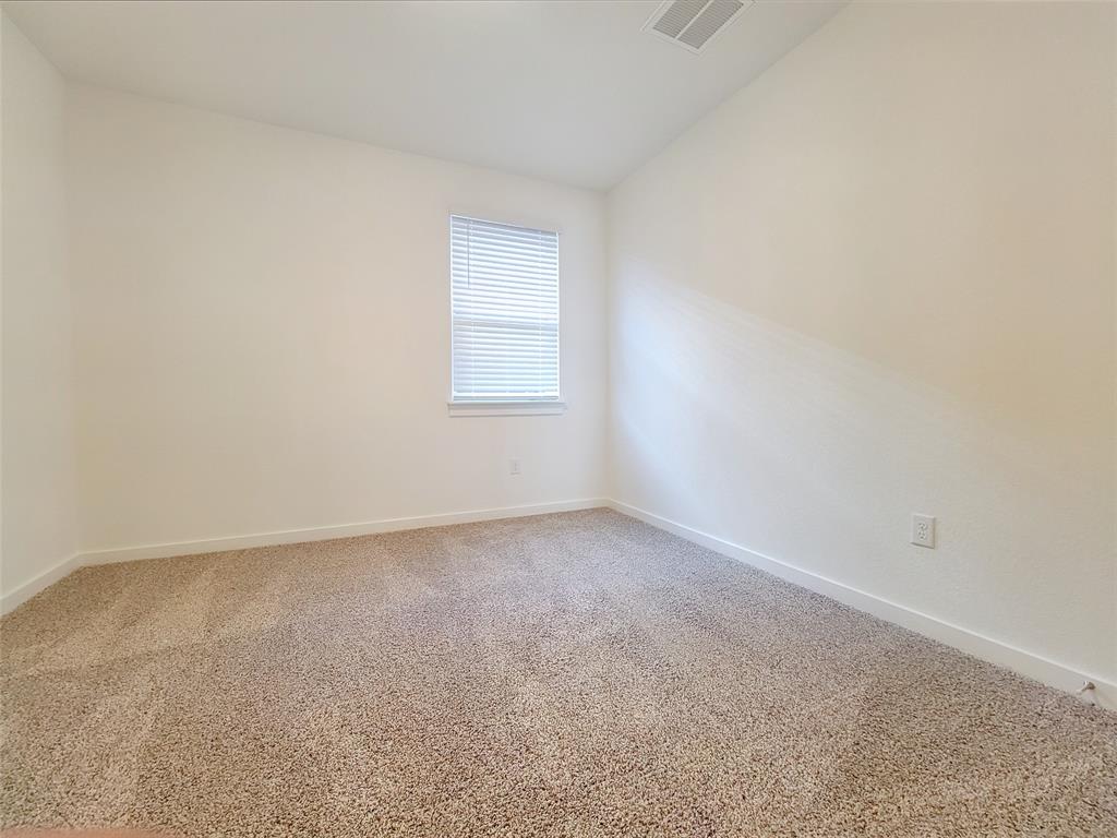 2032 Bobtail Pass Leander, TX 78641 - Photo 14 of 18 an empty room with a window