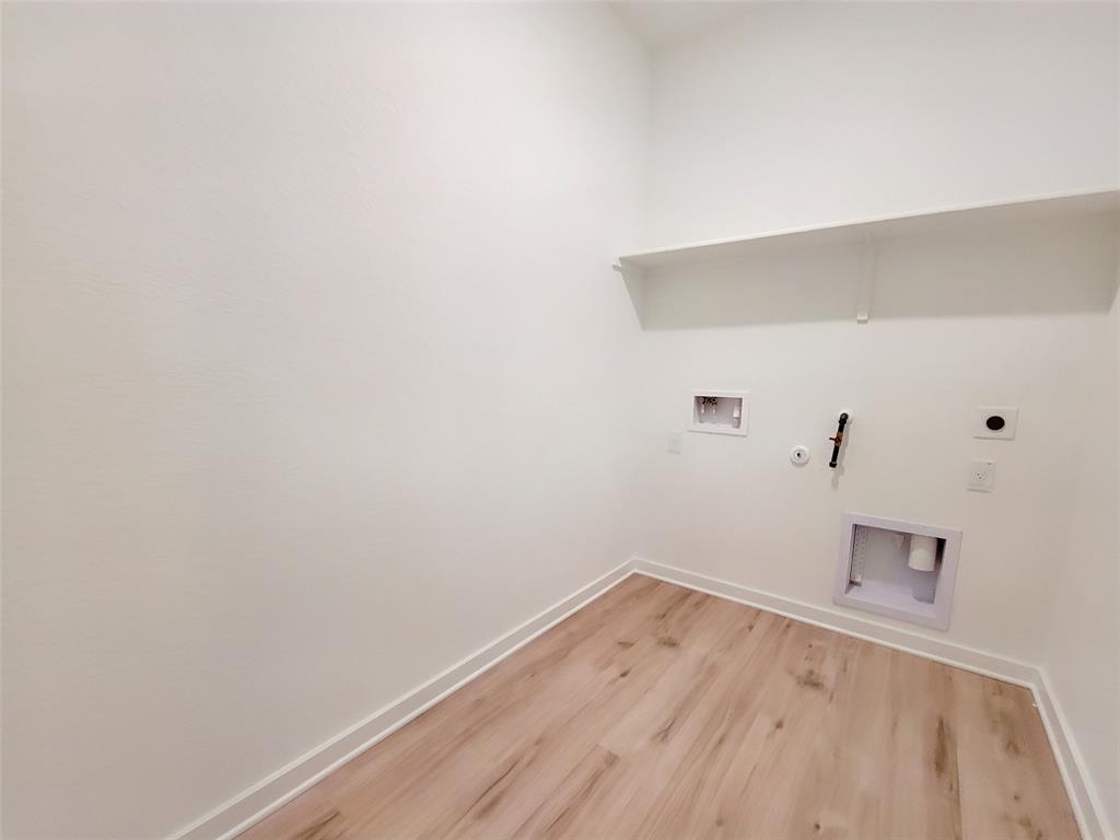 2032 Bobtail Pass Leander, TX 78641 - Photo 15 of 18 a view of a room with wooden floor