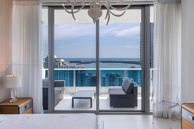 a view of a living room and a balcony