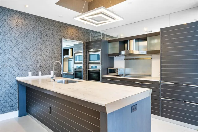 a kitchen with a stove and a sink