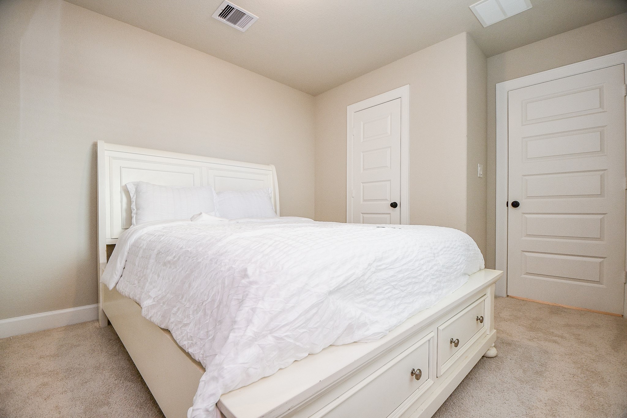 2033 Millbridge Spring Lane Houston, TX 77051 - Photo 12 of 15 a large white bed in a white room