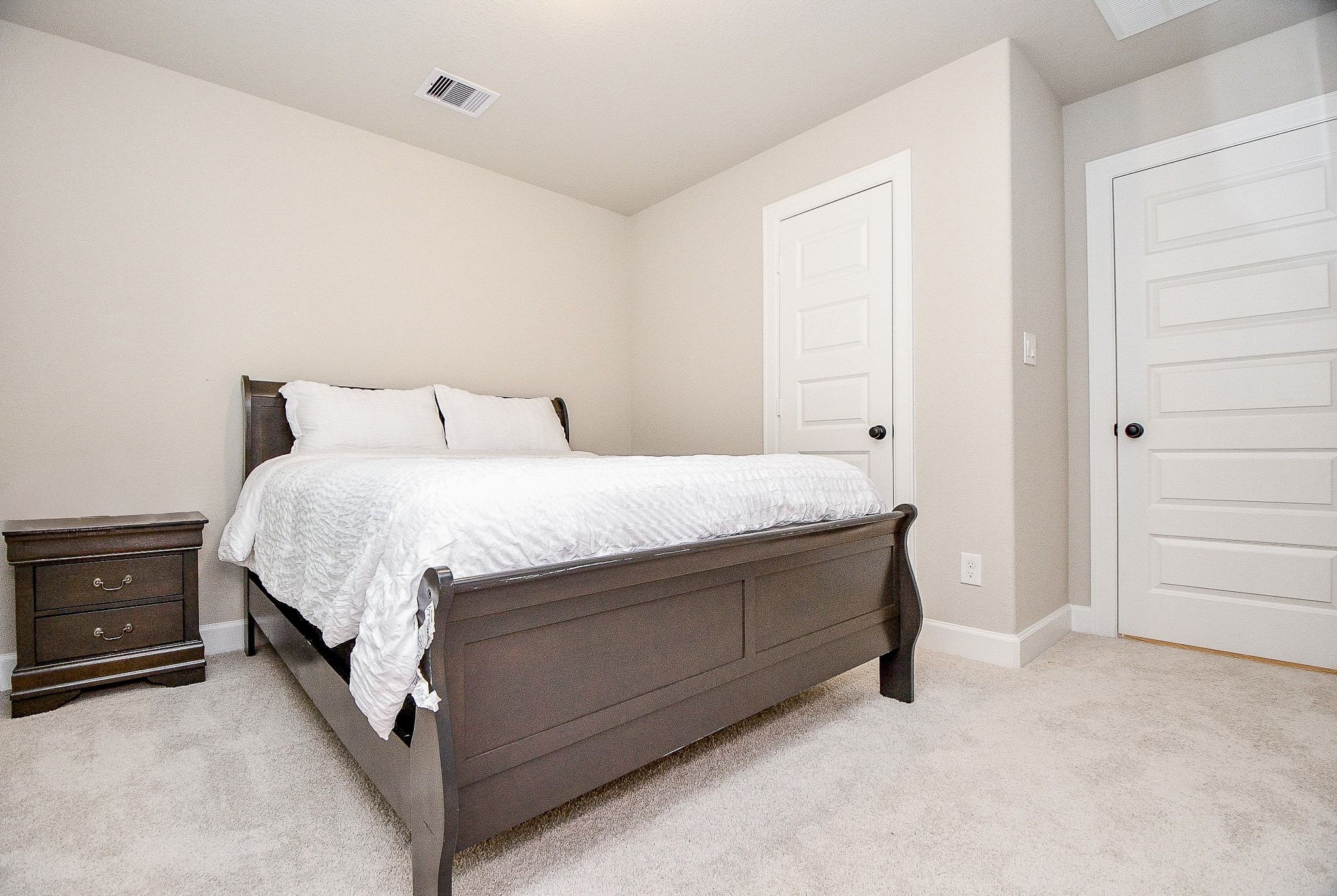 2033 Millbridge Spring Lane Houston, TX 77051 - Photo 13 of 15 a room with a bed and dresser