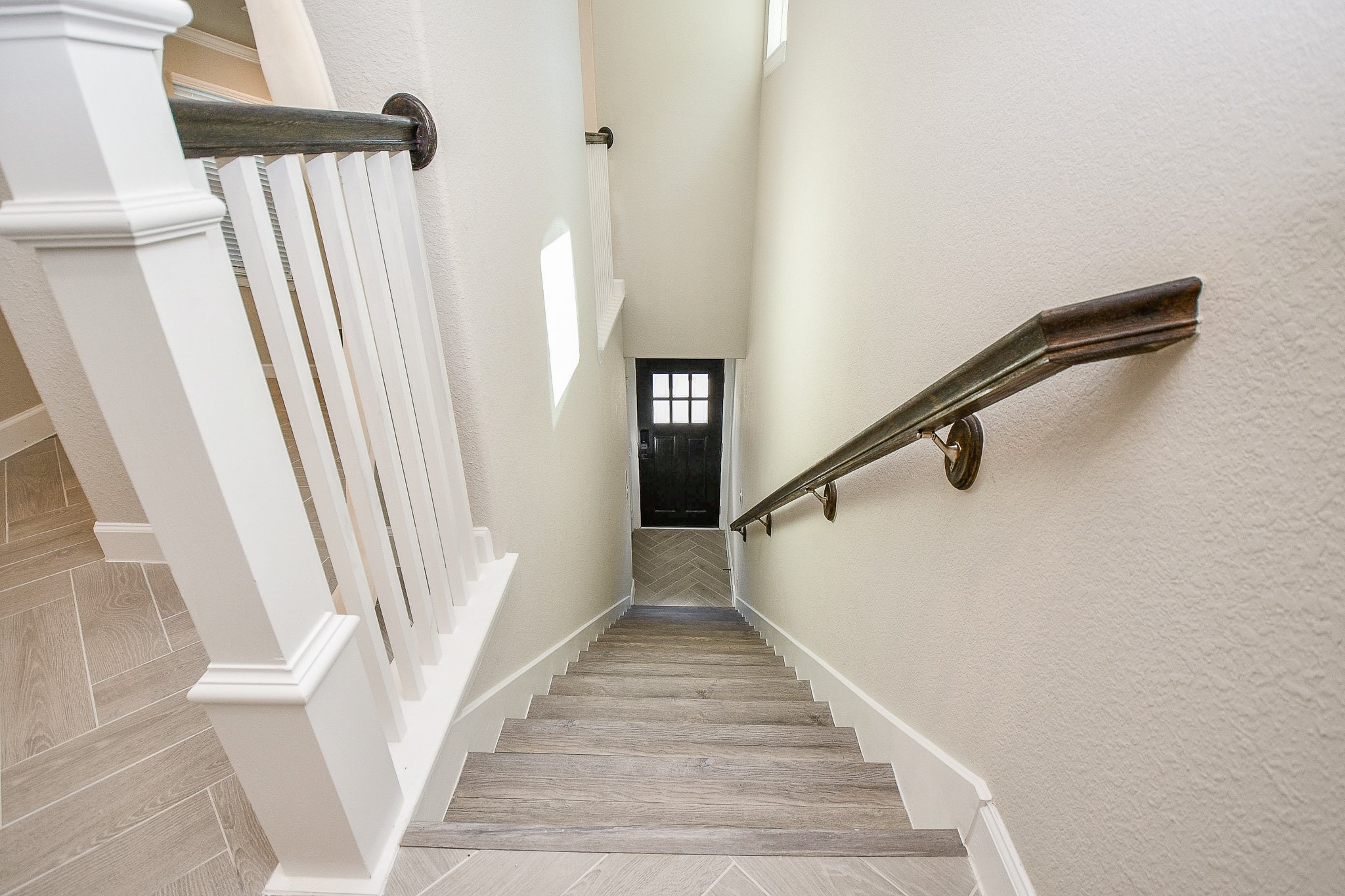2033 Millbridge Spring Lane Houston, TX 77051 - Photo 3 of 15 a view of staircase with white walls and railing