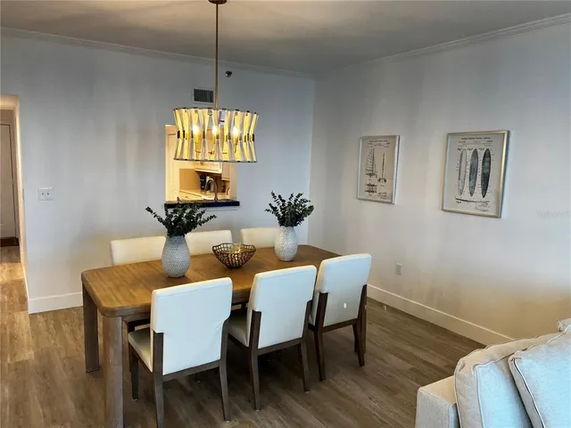 a bedroom with a bed and a mirror on dresser