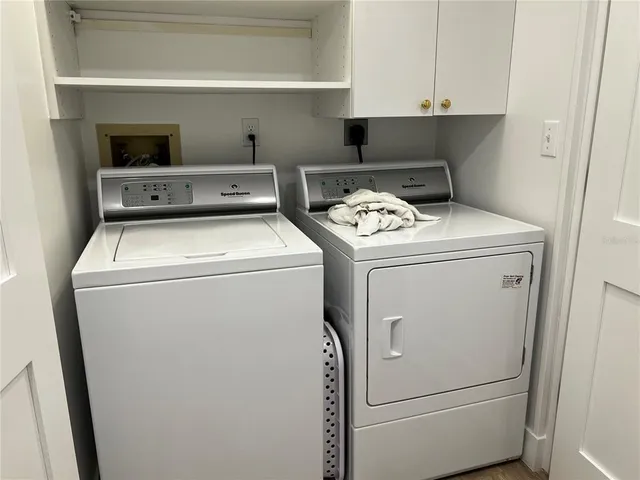 a view of a work space with furniture window and wooden floor