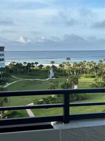 a view of a lake with sitting area