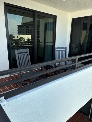 a sign that is sitting in front of flowers