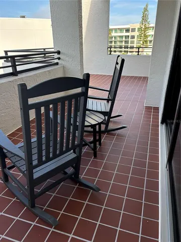 a view of a swimming pool with a bench and a lake view