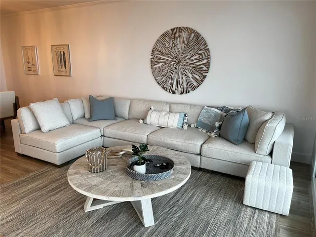 a kitchen with granite countertop white cabinets and stainless steel appliances