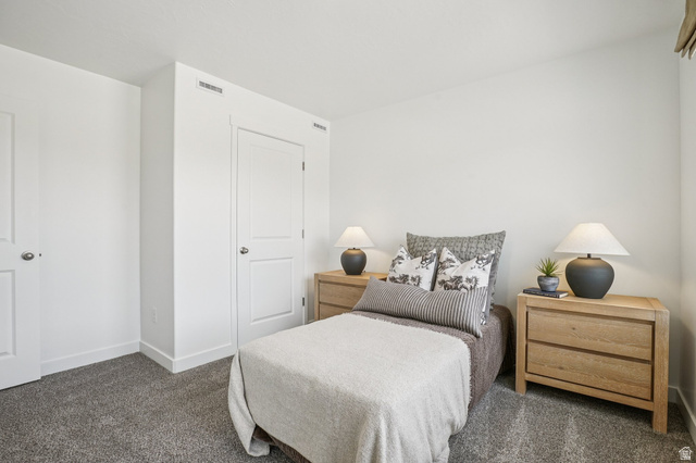 2097 North Ostler Peak Road, Unit 115 Heber City, UT 84032 - Photo 8 of 33 Carpeted bedroom featuring white walls and trim