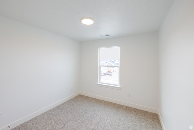 4741 Olive Avenue, Unit 406 Mapleton, UT 84664 - Photo 16 of 20 Carpeted spare room with baseboards
