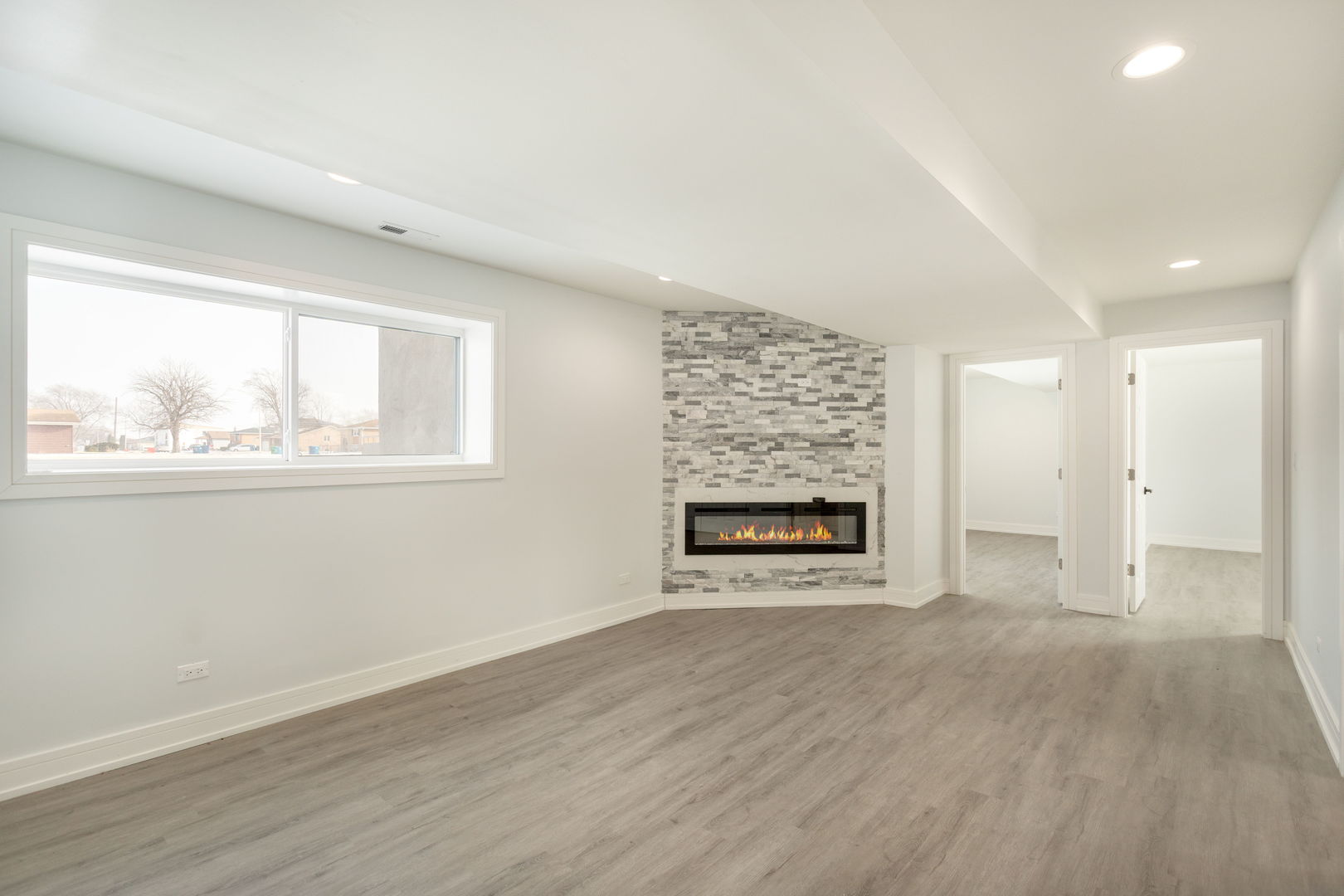 718 East 152nd Street Harvey, IL 60426 - Photo 17 of 33 a view of an empty room with a window and wooden floor