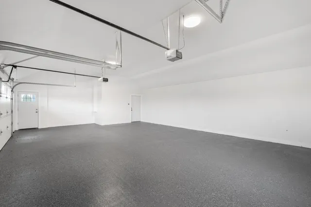 an empty room with a empty space and windows