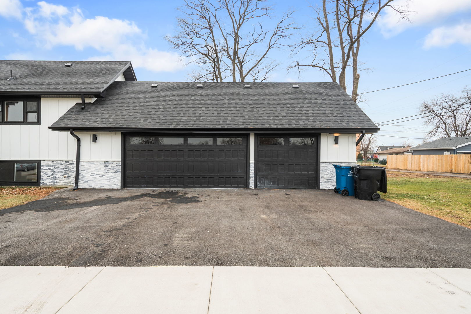 718 East 152nd Street Harvey, IL 60426 - Photo 25 of 33 a front view of a house with a yard and garage