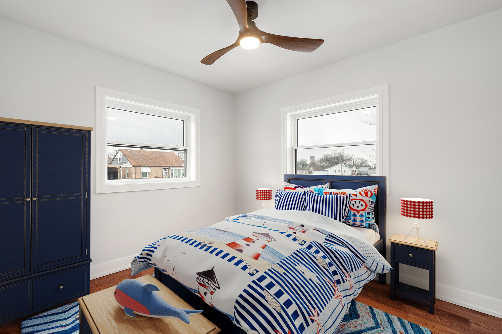 718 East 152nd Street Harvey, IL 60426 - Photo 10 of 33 a bedroom with a bed and wooden floor