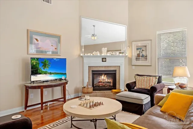 a living room with furniture and a fireplace