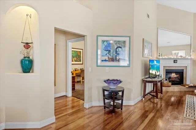a living room with furniture and a fireplace