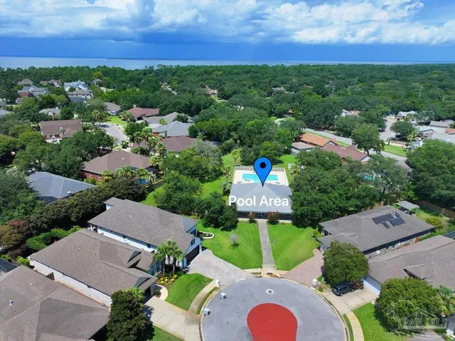 an aerial view of residential houses with outdoor space and street view