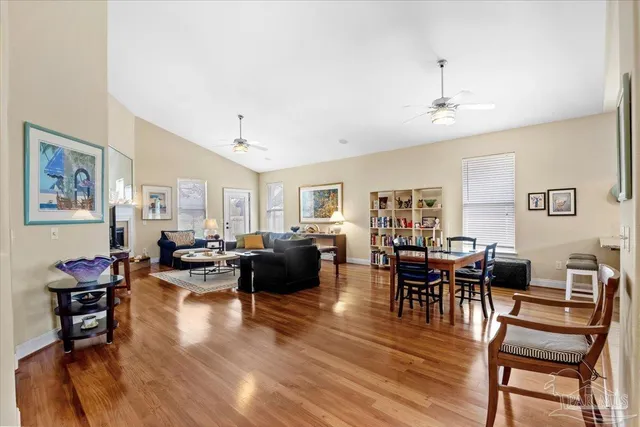 a living room with furniture or couch and a dining table