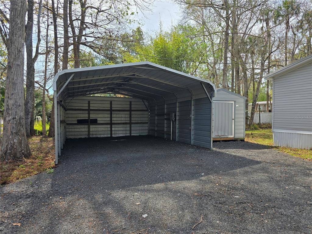 55921 Fern Road Astor, FL 32102 - Photo 17 of 24 a view of a house with a yard and tree s