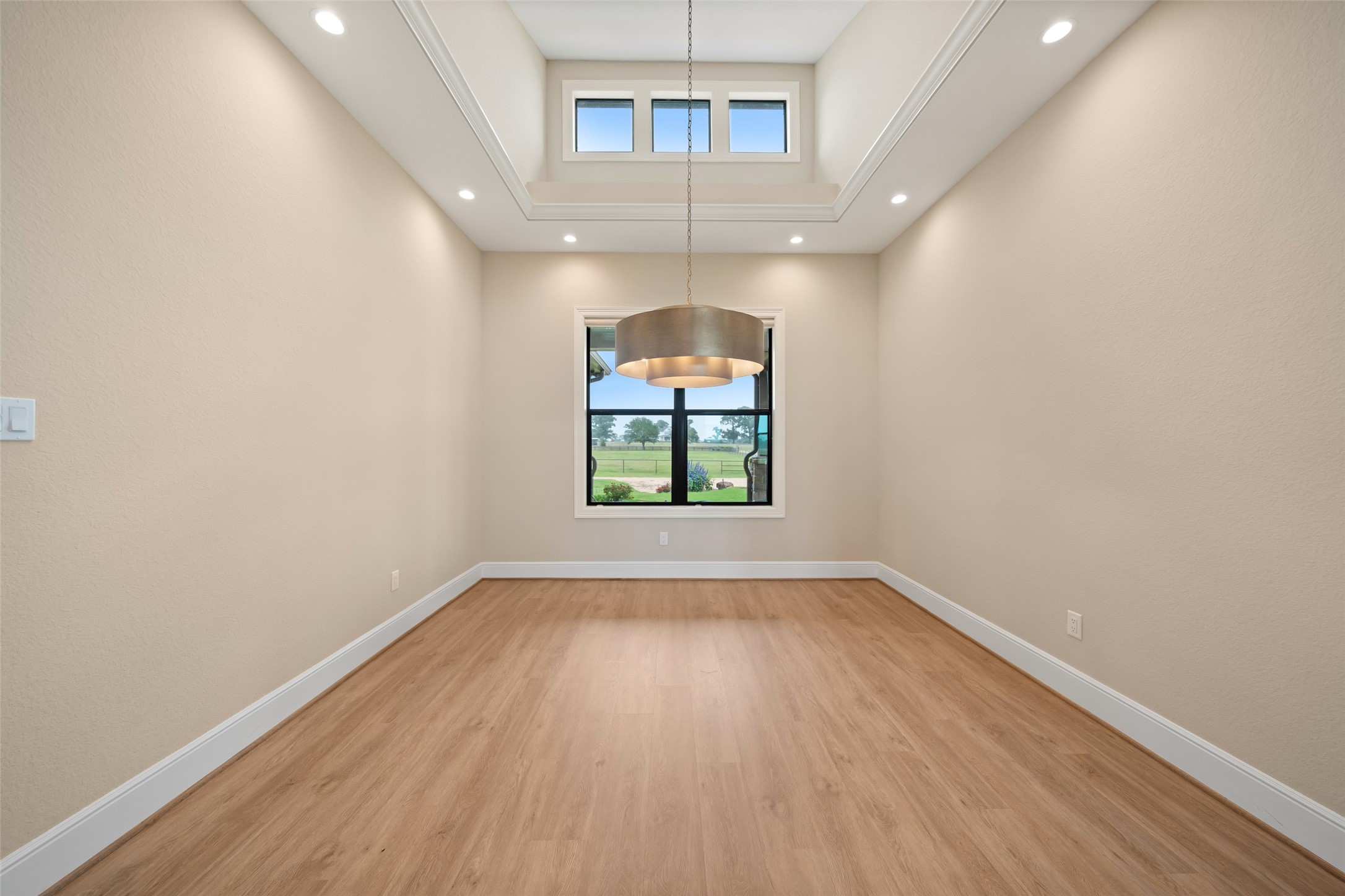 30163 High Spirit Ranch Road Hempstead, TX 77445 - Photo 8 of 49 wooden floor in an empty room with a window
