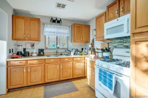 a view of a chairs and table in a balcony