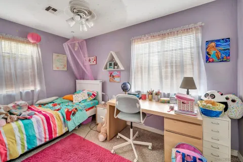 a play room with toys and a couch