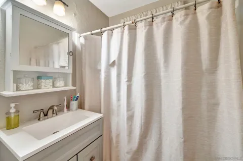 a view of a house with backyard sitting area and garden